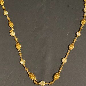 Costume metal and pearl strand necklace